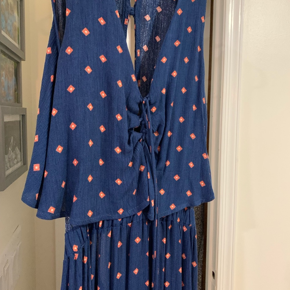Dark blue maxi dress with orange diamond pattern. Low-ish back.